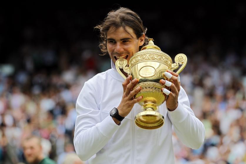MELBOURNE, AUSTRALIA - JANUARY 30: Rafael Nadal of Spain poses with the Norman Brookes Challenge Cup as he celebrates victory in his Men’s Singles Final match against Daniil Medvedev of Russia during day 14 of the 2022 Australian Open at Melbourne Park on January 30, 2022 in Melbourne, Australia. (Photo by Darrian Traynor/Getty Images)