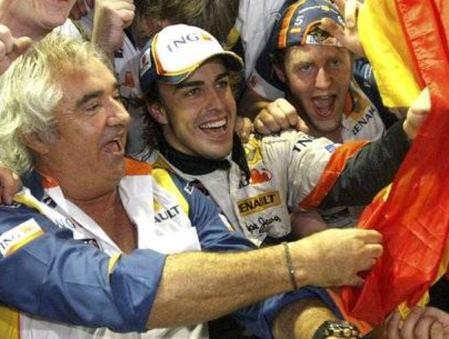 Renault Formula One driver Fernando Alonso of Spain, right, and Renault managing director Flavio Briatore cerebrate with his crew after winning the Singapore Grand Prix on Sunday, Sept. 28 in Singapore which held the first ever night Formula One race. (AP Photo/Wong Maye-E)
