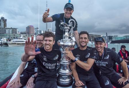 Emirates Team New Zealand crew, from left, Dan Bernisconi, Peter Burling, Glen Ashby, Blair Tuke and Ray Davies with the Americas Cup after defeating Italy’s Luna Rossa in race ten of the America’s Cup on Auckland’s Waitemata Harbour, Wednesday, March 17, 2021.Team New Zealand has retained the America’s Cup by beating Italian challenger Luna Rossa 7-3 in the 36th match for sailing’s oldest trophy. (Chris Cameron/Photosport via AP)